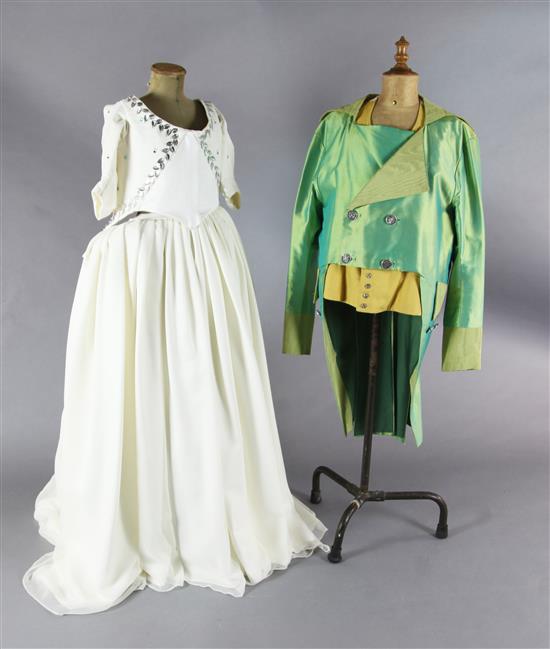 Don Giovanni: A rail with a mint green tail coat and yellow waistcoat and tights, a purple gold braided frock coat,
